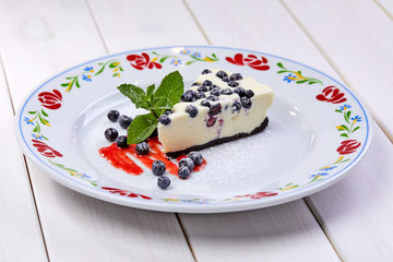 cheesecake with fresh blueberries and mint