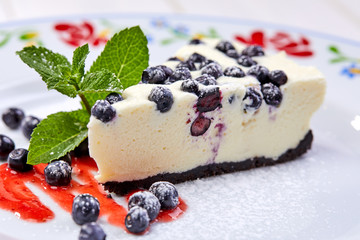 cheesecake with fresh blueberries and mint