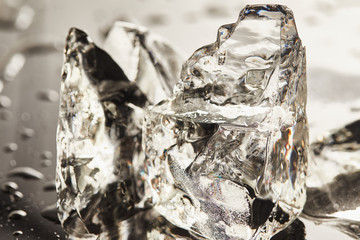 close up view of pure melting ice cubes with drops