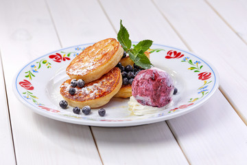 pancakes with ice cream and blueberries
