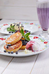 pancakes with ice cream and blueberries
