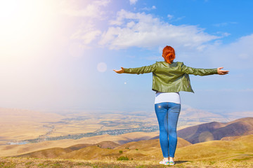 Beauty woman outdoors enjoying nature.