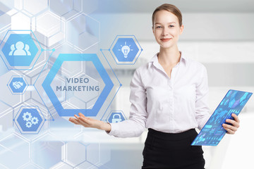 The concept of business, technology, the Internet and the network. A young entrepreneur working on a virtual screen of the future and sees the inscription: Video marketing