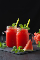 Cold watermelon juice and sliced watermelon.
