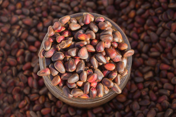 Cedar nuts in glass jar, top view