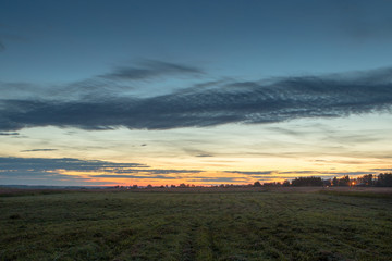 after sunset in the summer field