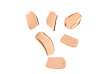 Liquid foundation swatch isolated on white background. Close Up of makeup cream sample.