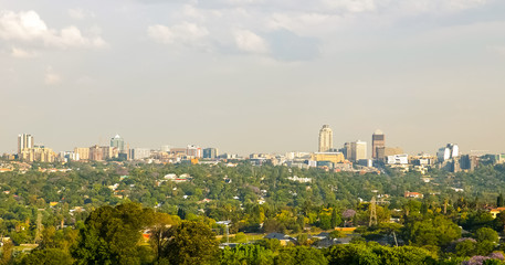 Fototapeta premium Skyline of buildings and residential suburban neighborhood in Sandton CBD Johannesburg