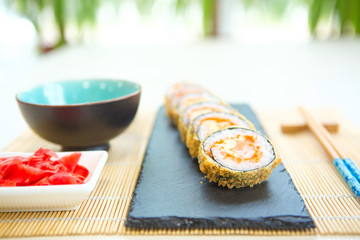 Japanese cuisine warm sushi rolls on a table Healthy and tasty food.