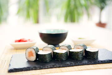 Golden dragon sushi roll with tuna, eel, cucumber, sesame seeds and tobiko caviar Healthy and tasty food.