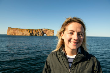 Fototapeta premium tourist woman enjoying Perce Rock view from Gaspe in Quebec