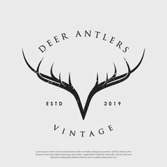 Deurstickers vector logo of vintage hipster deer antlers © Voxicord