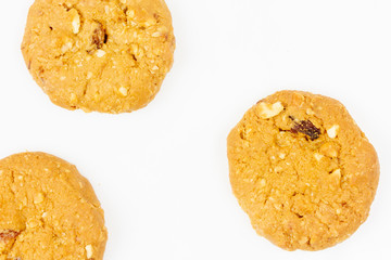 Oatmeal raisin cookies isolated on white background, top view.