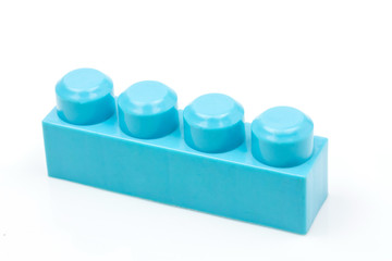 Blue plastic building block isolated on white background. Developmental toys for children.