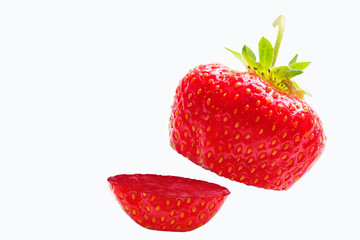 Sliced strawberries. Single strawberry fruit isolated on white background, with clipping path