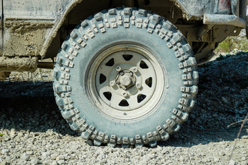 Off-road dirty car wheels. Swamp rubber. Jeep in the swamp. Trial competition.