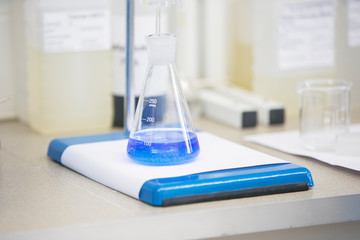 Flask with blue liquid in lab