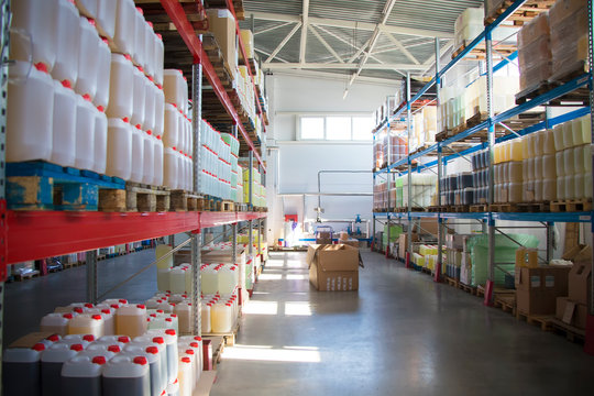 Chemical production.Warehouse with shelves, plastic cans.