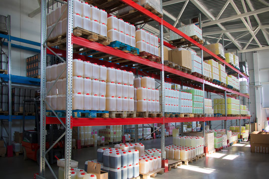  Chemical production.Warehouse with shelves, plastic cans.Warehouse with container