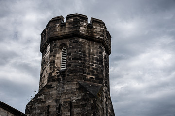Fototapeta na wymiar Watch tower of a penitentiary before a storm