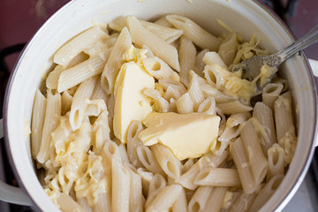 Pasta in a pan with butter close up
