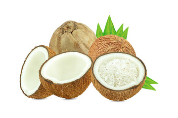 Coconuts and green palm tree leaf isolated on a white background.Healthy Food, skin care concept.