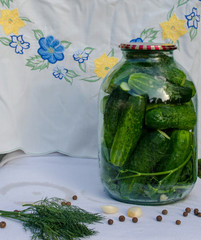 Pickled cucumbers in glass jar. Preservation of cucumbers for the winter.