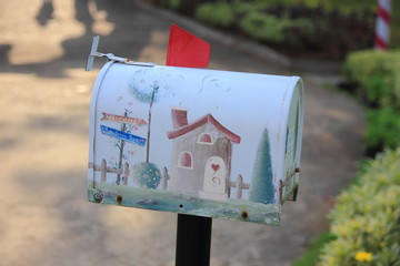 White letter box in the garden.