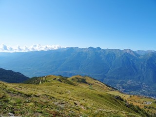 Nature, meadows and peaks that characterize the landscape of the Italian Alps in Val di Susa, near...