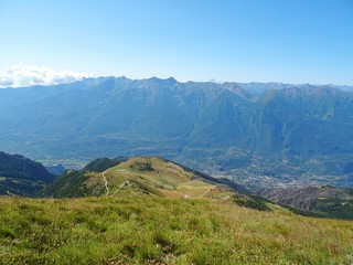 Nature, meadows and peaks that characterize the landscape of the Italian Alps in Val di Susa, near the town of "Susa", Piedmont - August 2019.