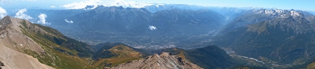 Nature, meadows and peaks that characterize the landscape of the Italian Alps in Val di Susa, near...