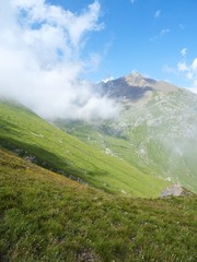 Nature, meadows and peaks that characterize the landscape of the Italian Alps in Val di Susa, near...