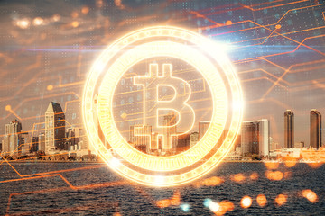 Double exposure of crypto currency theme hologram drawing and city veiw background. Concept of...