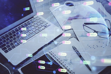 Double exposure of table with computer on background and data theme drawing. Concept of innovation.