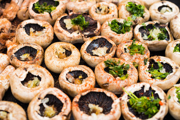Baked mushrooms, roasted with fresh coriander and garlic. Vegan food. Stuffed champignon.