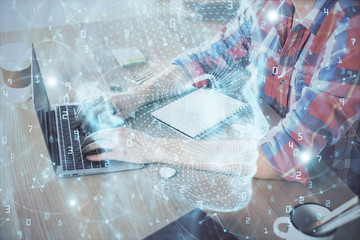 Man typing on keyboard background with brain hologram. Concept of big Data.