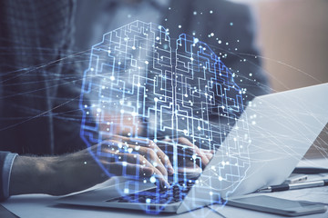 Man typing on keyboard background with brain hologram. Concept of big Data.