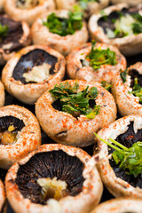 Baked mushrooms, roasted with fresh coriander and garlic. Vegan food. Stuffed champignon.