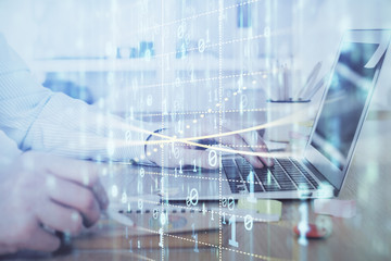 Fototapeta premium Businessman working on Laptop with technology theme drawing. Concept of big data. Double exposure.