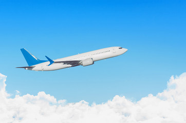 Fototapeta na wymiar Airplane in the sky above the cloudscape flight journey trip.