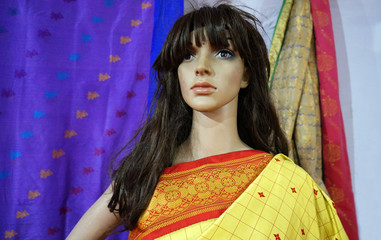 Indian mannequin dressed in traditional hand loom made saree or sari in a retail shop