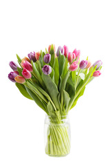Bouquet of spring tulips flowers in a transparent glass jar isolated on white