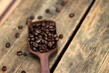 Coffee Beans in a Wooden Scoop