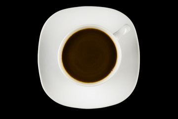 Obraz na płótnie Canvas Cup of coffee on a black background - top view