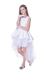 Happy beautiful little girl in white dress posing on white background