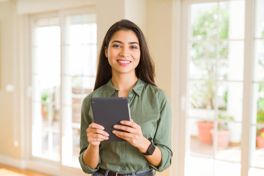Beautiful young woman working using touchpad tablet