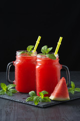 Cold watermelon juice and sliced watermelon.