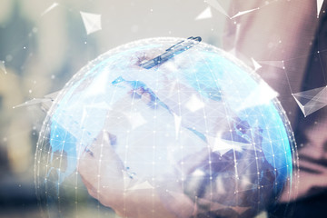 International business hologram over hands taking notes background. Concept of success. Multi exposure