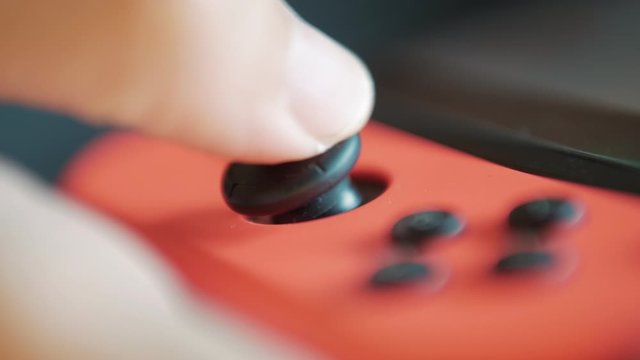 Gamer playing video game by using game controller
