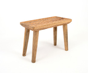 Wooden handmade vintage stool by side on the white isolated background